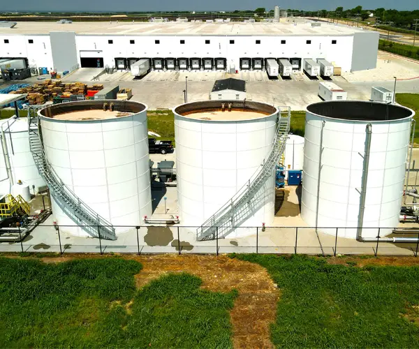 background image of a Weston and Associates dry bulk storage tank by